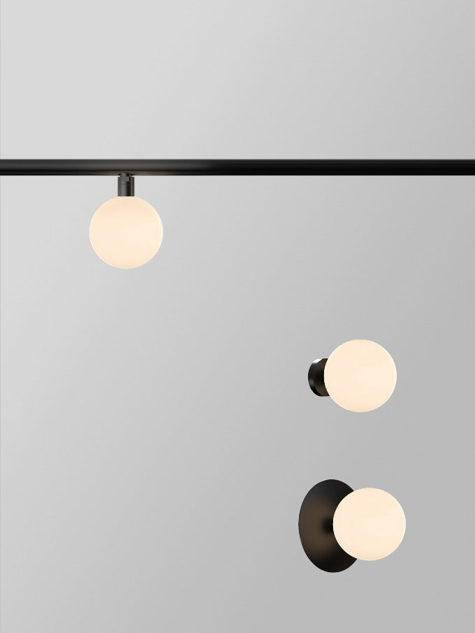 Typography Vela Globe 85 Rail Luminaire | Photo: Rakumba