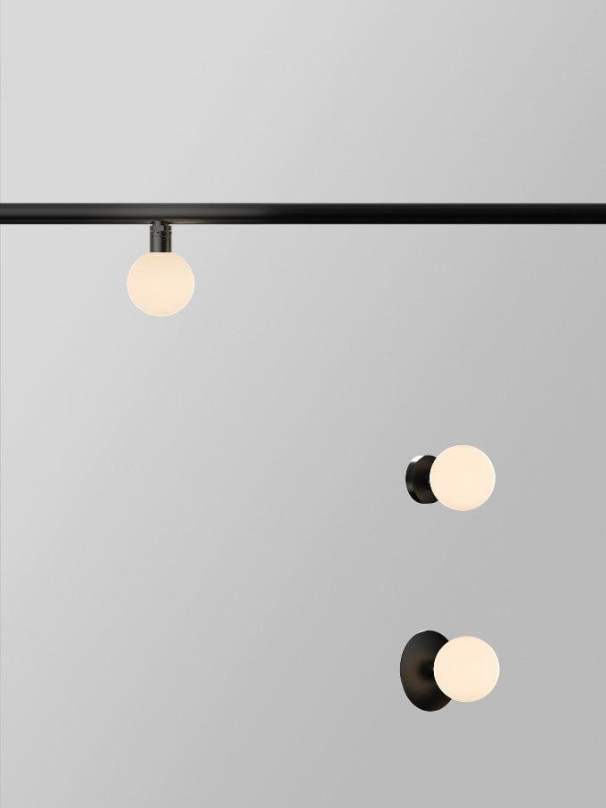 Typography Vela Globe 60 Rail Luminaire | Photo: Rakumba