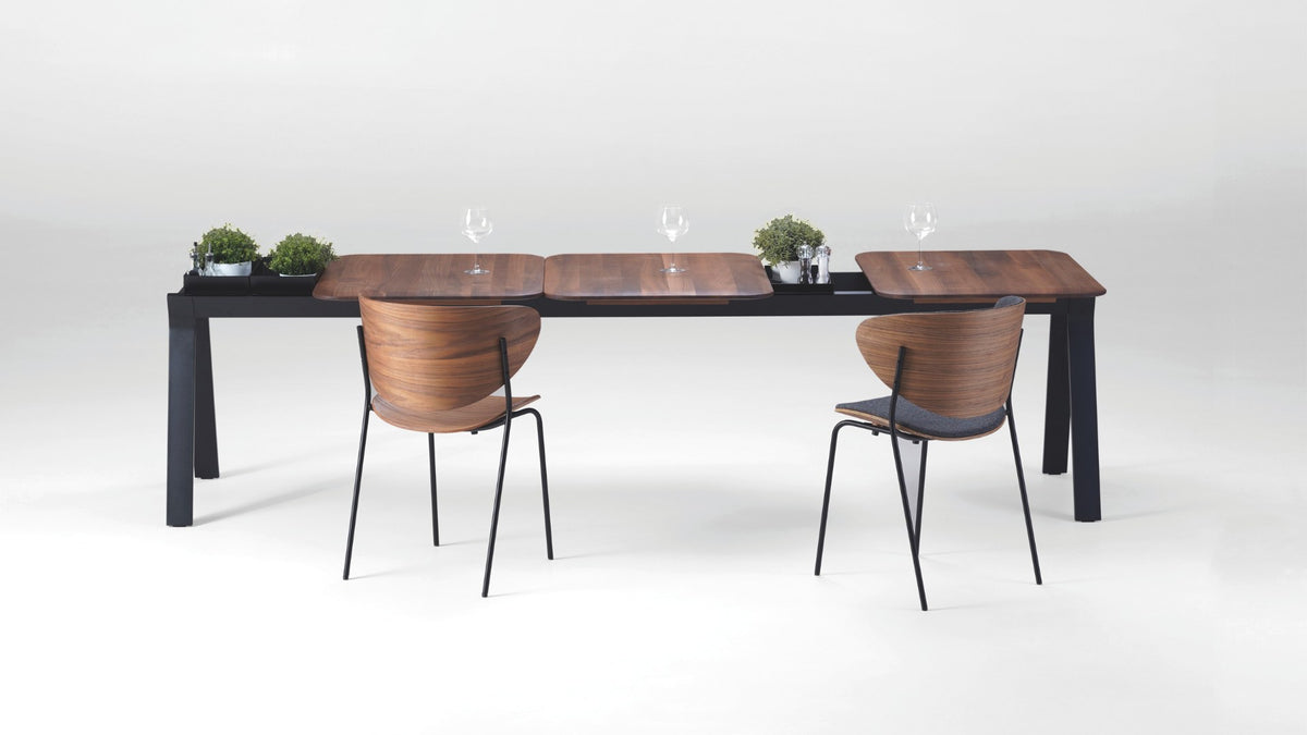 NUNC Ala dining table, American walnut plates on black base with integrated containers