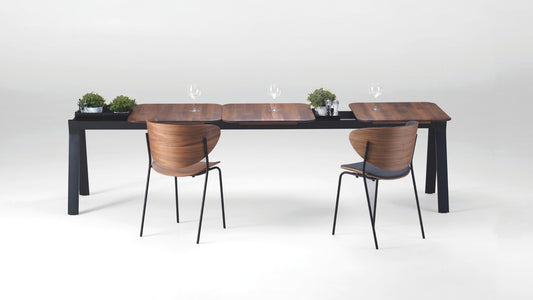NUNC Ala dining table, American walnut plates on black base with integrated containers