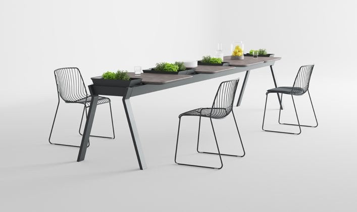 NUNC Ala outdoor table, integrated containers with plants